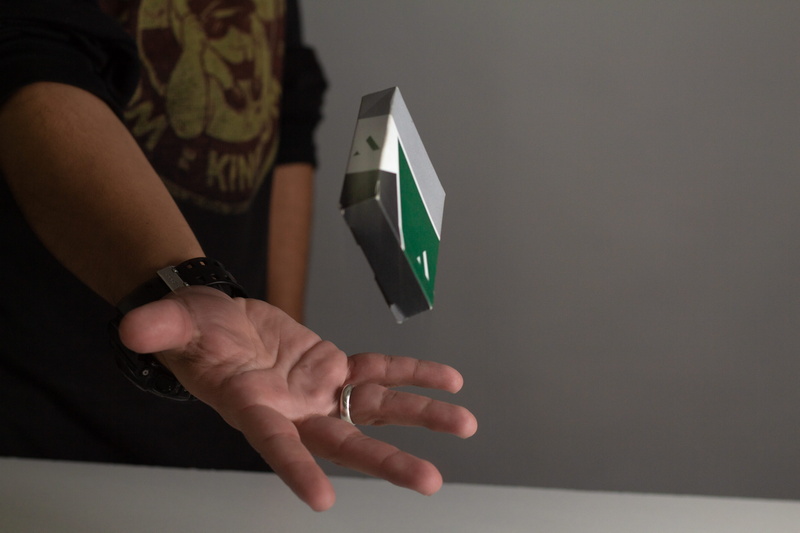 cards, real people, midsection, holding, 5K, focus on foreground, one person, indoors, floating, box, human body part, adult, electronics, men, wrist