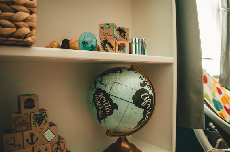 ball, still life, modern art, globe - man made object, white, close-up, universe, desk, wall clock, shelf, home interior, greeting card, representation