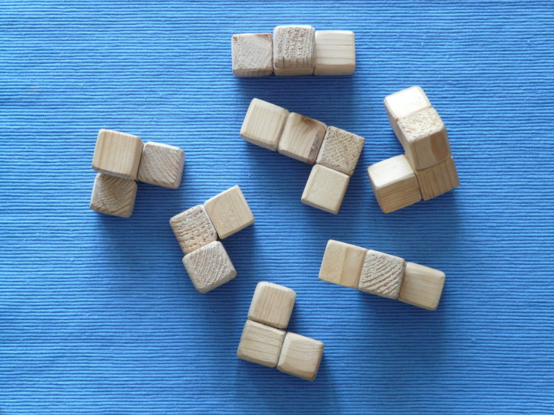 cubes, puzzle piece, wood, directly above, puzzle, brown, variation, pattern, abundance, colored background, shape, wood block, wooden toys, 2K, studio shot