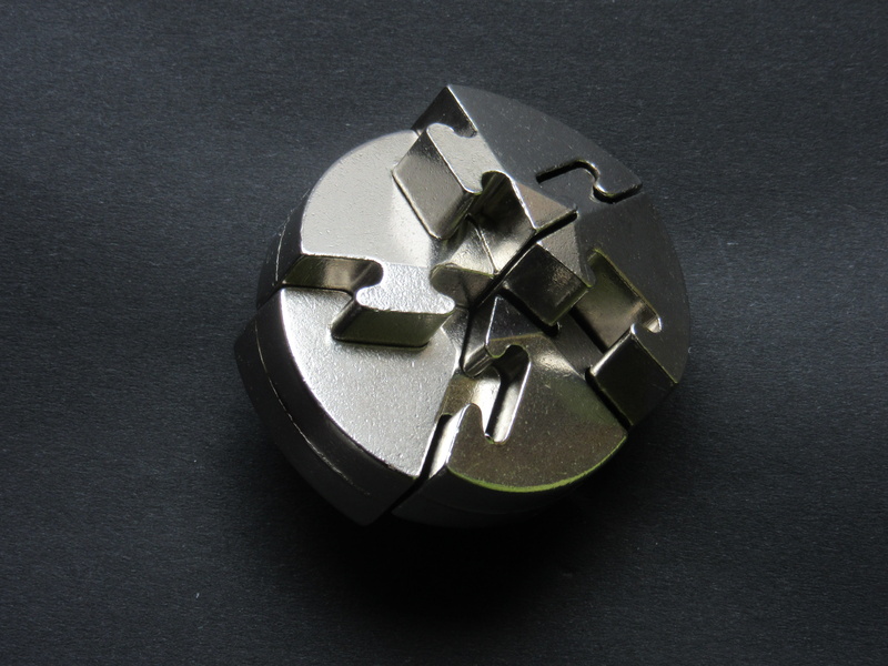 pieces of the puzzle, 4K, high angle view, close-up, metal puzzle, steel, studio shot, toys, puzzles, gray background, puzzle, teeth, single object, no people