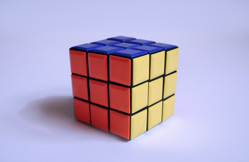 toy, block shape, multi colored, colored background, indoors, rubik, still life, geometric shape, cube, block, cube Shape, close-up, studio shot, shape