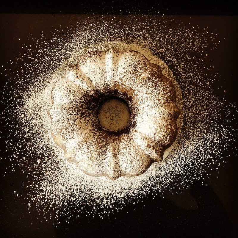 food and drink, bundt, temptation, geometric shape, table, high angle view, ingredient, indoors, shape, sweet food, freshness, dessert, sugar, black background