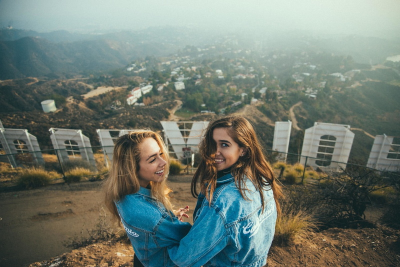 hairstyle, positive emotion, beautiful woman, adult, outdoors, bonding, model, hollywood sign, hair, togetherness, nature, face, city, young adult, building exterior
