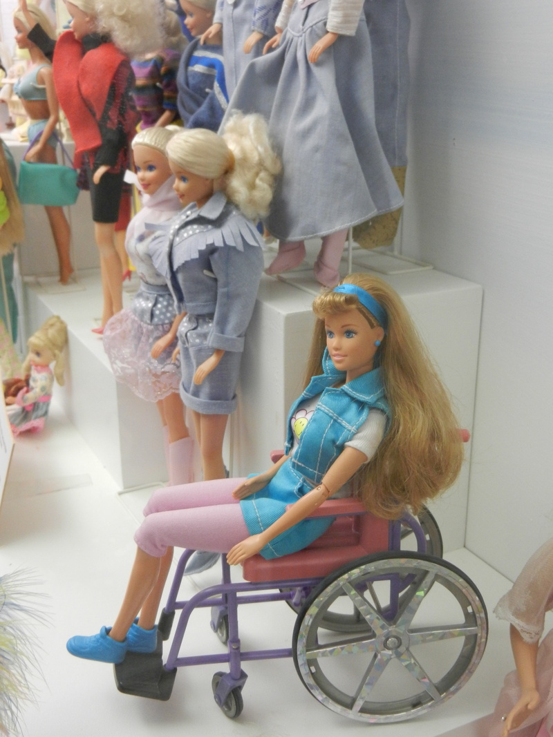 a disability, family, indoors, wheelchair, stroller, togetherness, group of people, females, sitting, people, women, doll, disabled, childhood, leisure activity