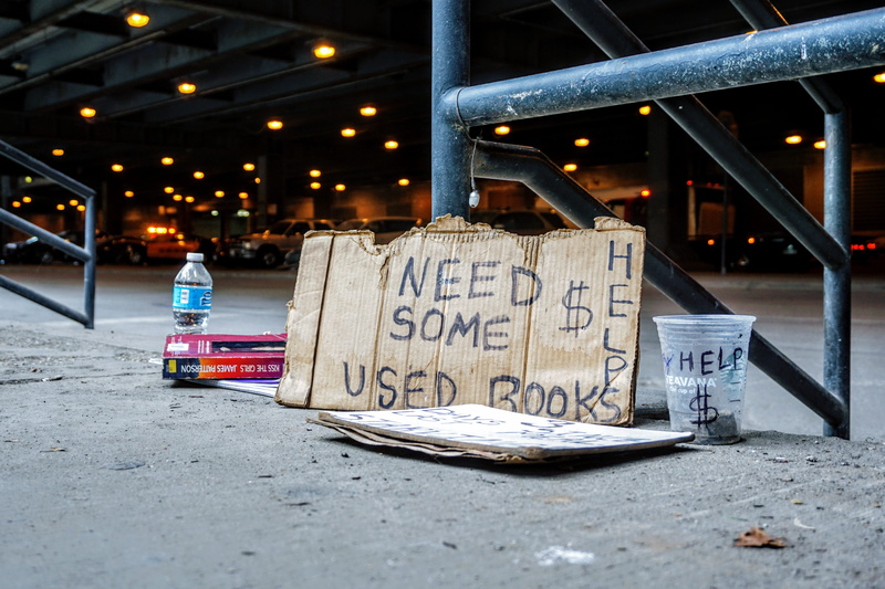 building exterior, urban, broke, road, script, cars, information, night, ground, business, box, pavement, western script, signboard, glass, money, brown