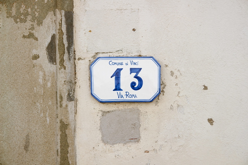 number, wall - building feature, close-up, disabled access, architecture, house number 13, outdoors, white, information, sign, space, blue, minimal, design