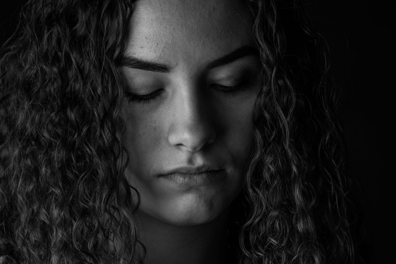 young adult, studio shot, depression, sadness, close-up, closing, serious, black and white, dark, eyes, black, body part, hair, headshot, portrait, thoughts