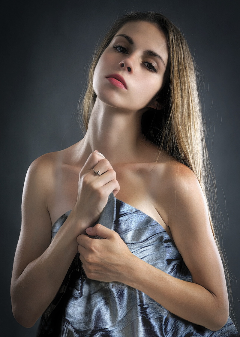 peace of mind, hairstyle, young, top, adult, hand, gray, woman, indoors, young adult, one person, black background, hair, waist up, women, posing, face