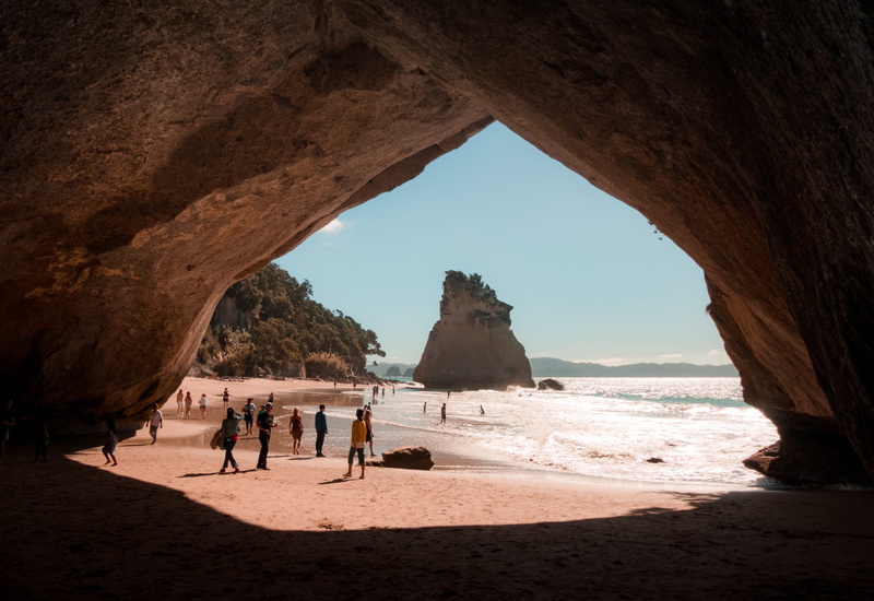 cave, sea, body of water, light, summer, leisure activity, rock - object, daylight, fun, vacation, seashore, day, walking, landscape, body, land, relaxation
