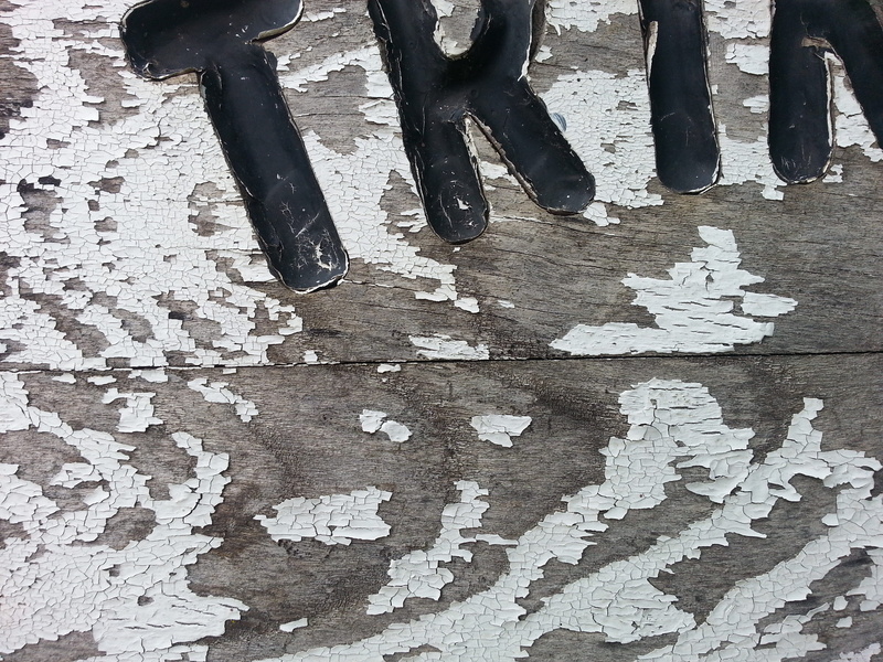 algoma, shoe, close-up, white color, canada, body part, weathered, flaky paint, human leg, photo, sign, black color, 2K, gray, day, wood, directly above