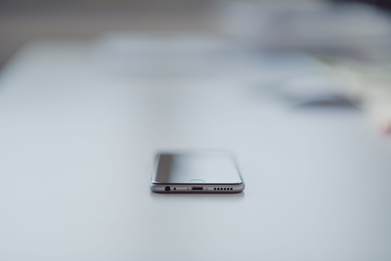 mode of transportation, studio shot, iphone6s, indoors, motor vehicle, wireless technology, connection, focus on foreground, single object, apple, still life