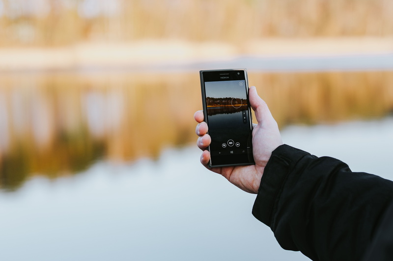 hand, dog, screen, wireless technology, portable information device, photographing, outdoors, people, one Person, 5K, focus on foreground, technology