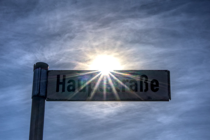 street sign, nature, blue, direction, communication, directory, shield, message, cloud - sky, outdoors, western script, note, sky, low angle view, dazzling star