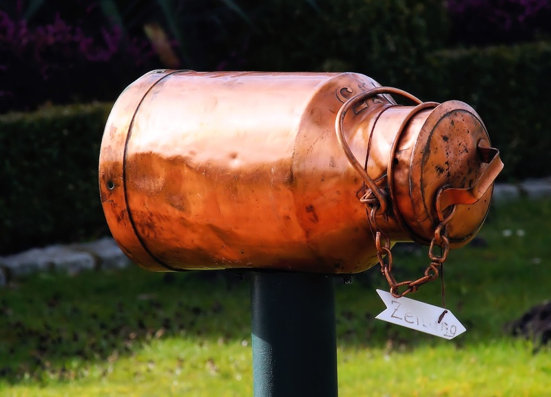grass, rusty, connection, colored, pipe - tube, focus on foreground, safety, milk can, copper, churn, decoration, eye catcher, shiny, field, text, milk