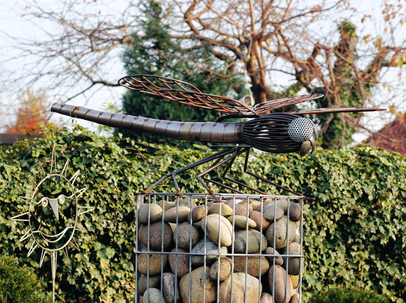ornament, garden decor, wood - material, focus on foreground, field, gardening equipment, wood, growth, beauty in nature, artwork, tree, outdoor, garden