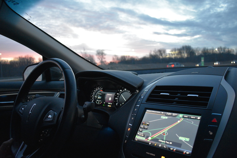 land vehicle, dashboard, motor vehicle, glass - material, sky, auto, control panel, smartphone, road, gps, location, mode of transportation, steering wheel