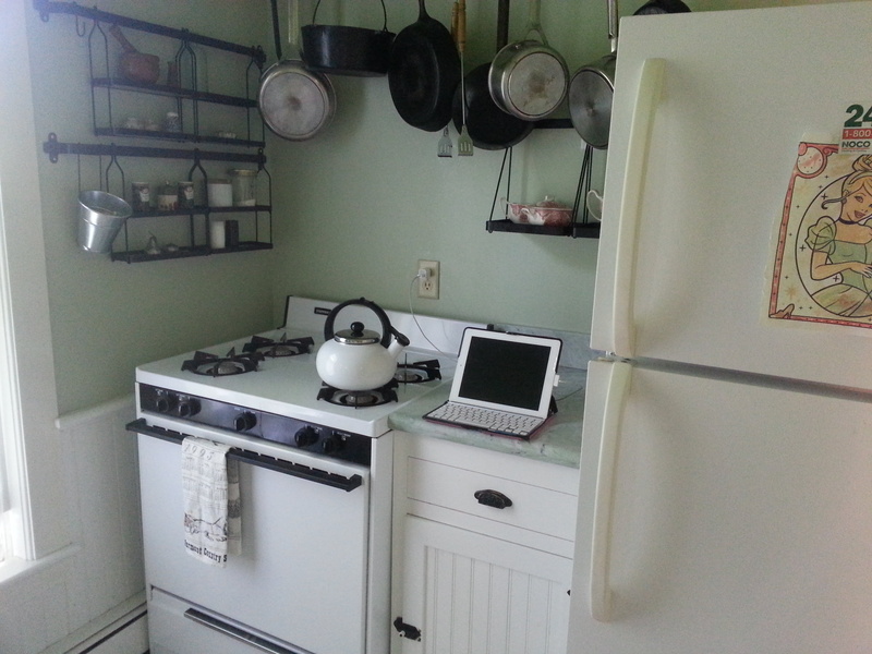 kitchen sink, computer, pots, stove, domestic Kitchen, sink, domestic room, side, home Interior, ipad, clock, no people, gas, oven, cabinet, microwave