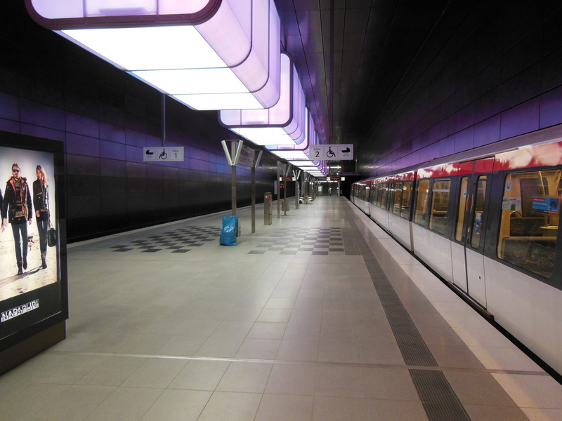 passengers, travel, built structure, illuminated, underground, railroad station platform, railway station, indoors, tiled floor, diminishing perspective