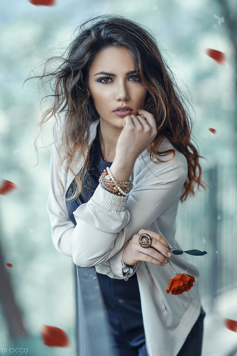 petals, make up, 1080P, brunette, white clothing, curly hair, women, brown eyes, Alessandro Di Cicco, wind, lipstick, black clothing, jacket, flowers