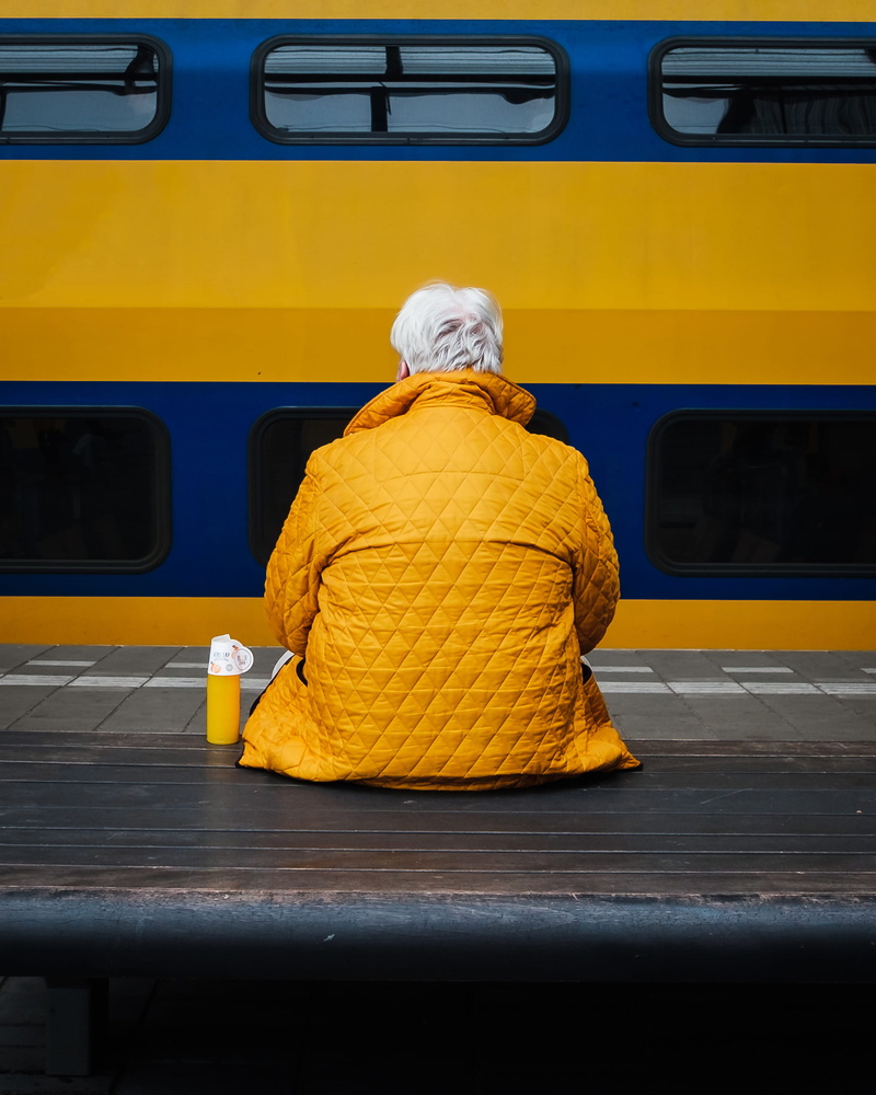 rail transportation, real people, land vehicle, bottle, color, person, orange juice, rear view, top, man, outdoors, clothing, 1080P, candid, minimal, jacket