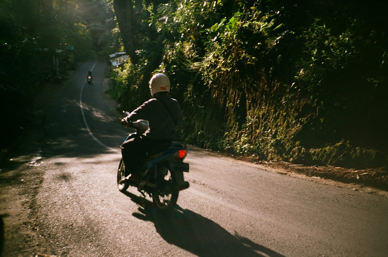 tree, mode of transportation, human, concrete, 2K, nature, motorcycle, lifestyles, indonesia, sunlight, vehicle, clothing, gravel, full length, riding