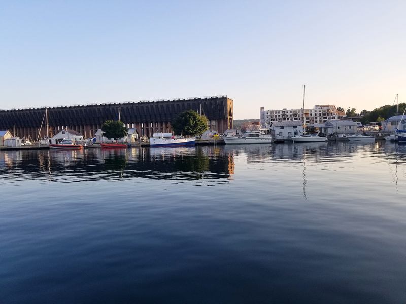 train, transportation, calm water, sky, tree, fishing industry, lake superior, copy space, passenger craft, building exterior, sail boat, calm river, sail
