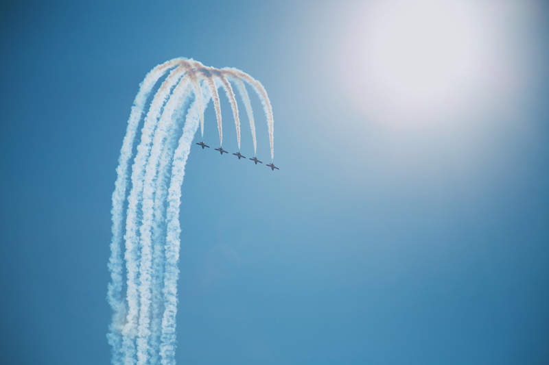 mode of transportation, airshow, plane, formation flying, low angle view, air vehicle, teamwork, cloud - sky, smoke - physical structure, aircraft, transportation