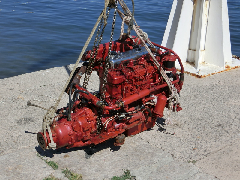 pier, motor, nautical vessel, railing, outdoors, metal, marine engine, watercraft, internal combustion engine, industry, high angle view, moored, machinery