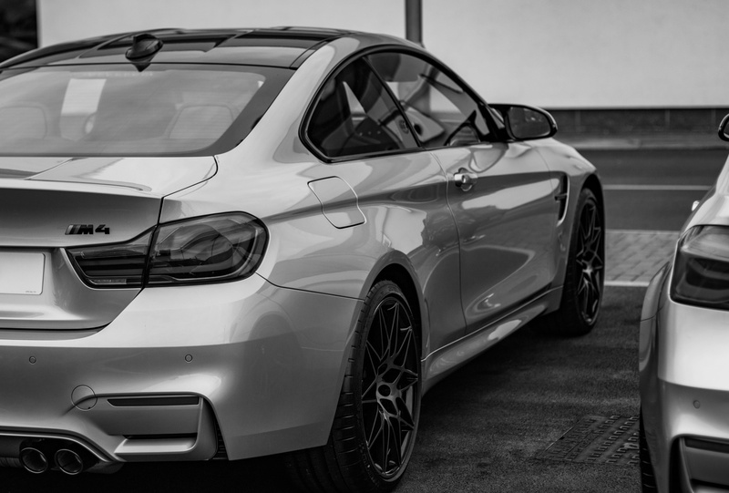 driver, focus on foreground, personal land vehicle, luxury, modern, motor vehicle, road, street, transport, travel, new, mode of transportation, fast, land vehicle