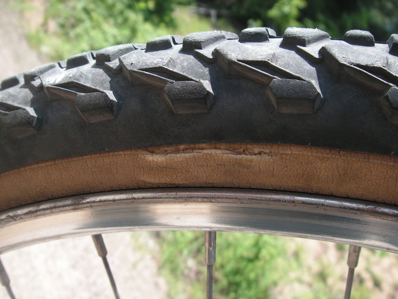 transportation, damage, transport, outdoors, bicycle, metal, pattern, puncture, day, cycle, land vehicle, nature, focus on foreground, close-up, breakdown