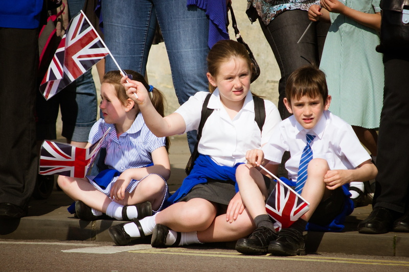 uniform, young, girls, joy, women, children, union jack, males, waving, street, offspring, union, emotion, innocence, jack, togetherness, group of people