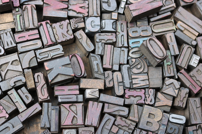 ink, indoors, communication, buffer, paper, high angle view, letter, close-up, abundance, typescript, no people, art and craft, backgrounds, vintage, flea market