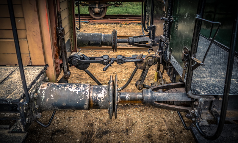 pipe - tube, architecture, connection, deterioration, outdoors, abandoned, wheel, hook, hard, industry, nature, transportation, rails, equipment, high angle view