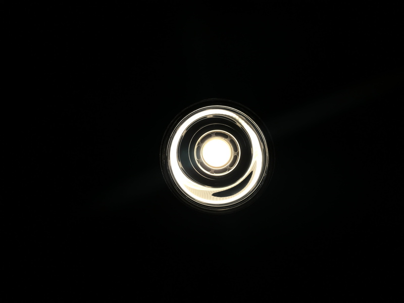 light bulb, lighting equipment, illuminated, electricity, ceiling, directly below, lighting, dark, circle, focus, black background, astronomy, cut out