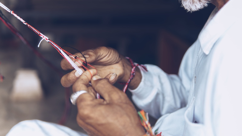 close, sitting, focus, hospital, creator, professional occupation, care, males, holding, maker, lab coat, doctor, red, healthcare and medicine, weaving