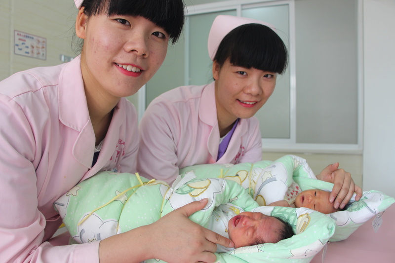 adult, bonding, two people, women, twin sisters, baby, emotion, saint ann maternity hospital, childhood, females, medical sisters, maternity hospital, chinese Ethnicity