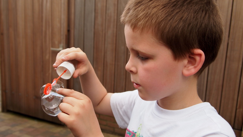 domestic life, holding, day, play, offspring, feel, boys, brown hair, pricks, call bladder, headshot, indoors, boy, summer, childhood, face, innocence