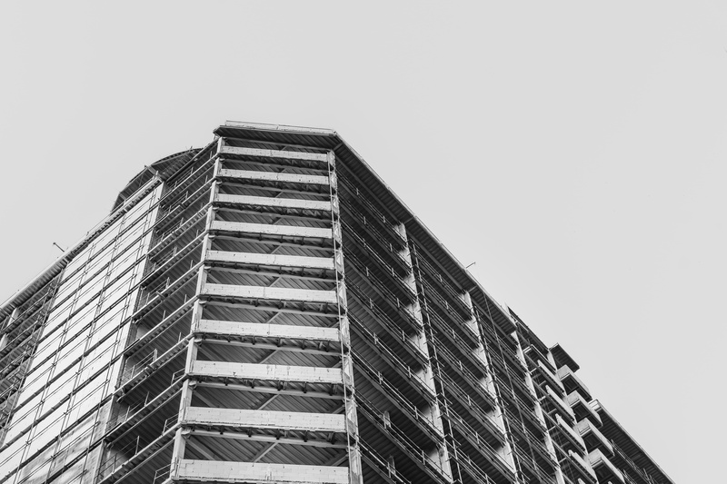 concrete, no people, day, tall - high, housing, building, low angle view, demolition, copy space, built structure, building exterior, office building exterior