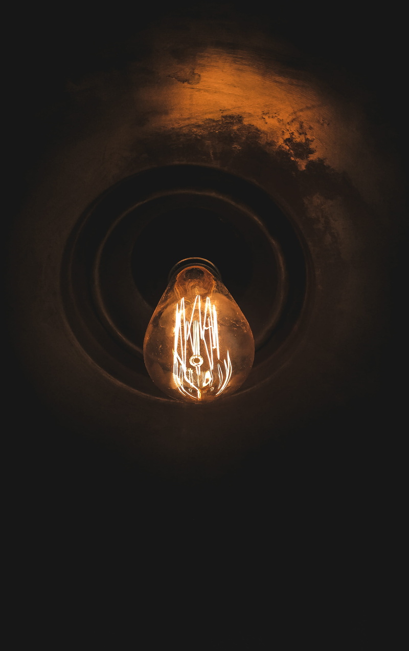 lamp, flare, sunlight, gravel, texture, pattern, indoors, glass - material, electrical equipment, close-up, electricity, lightbulb, black background, power supply