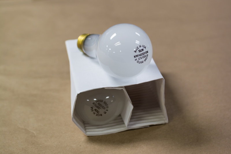 focus on foreground, cup, watt, indoors, food, no people, close-up, electric, light bulb, three objects, white color, crockery, kitchen utensil, salt shaker