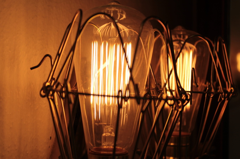 glowing, connection, focus on foreground, light - natural phenomenon, dark, light, light bulb, electric lamp, indoors, metal, transparent, close-up, orange color