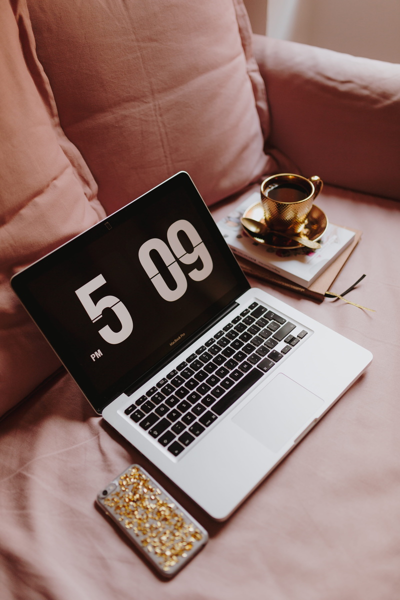 portable information device, macbook, study, table, text, workplace, furniture, black color, workspace, room, computer, female office, wireless technology