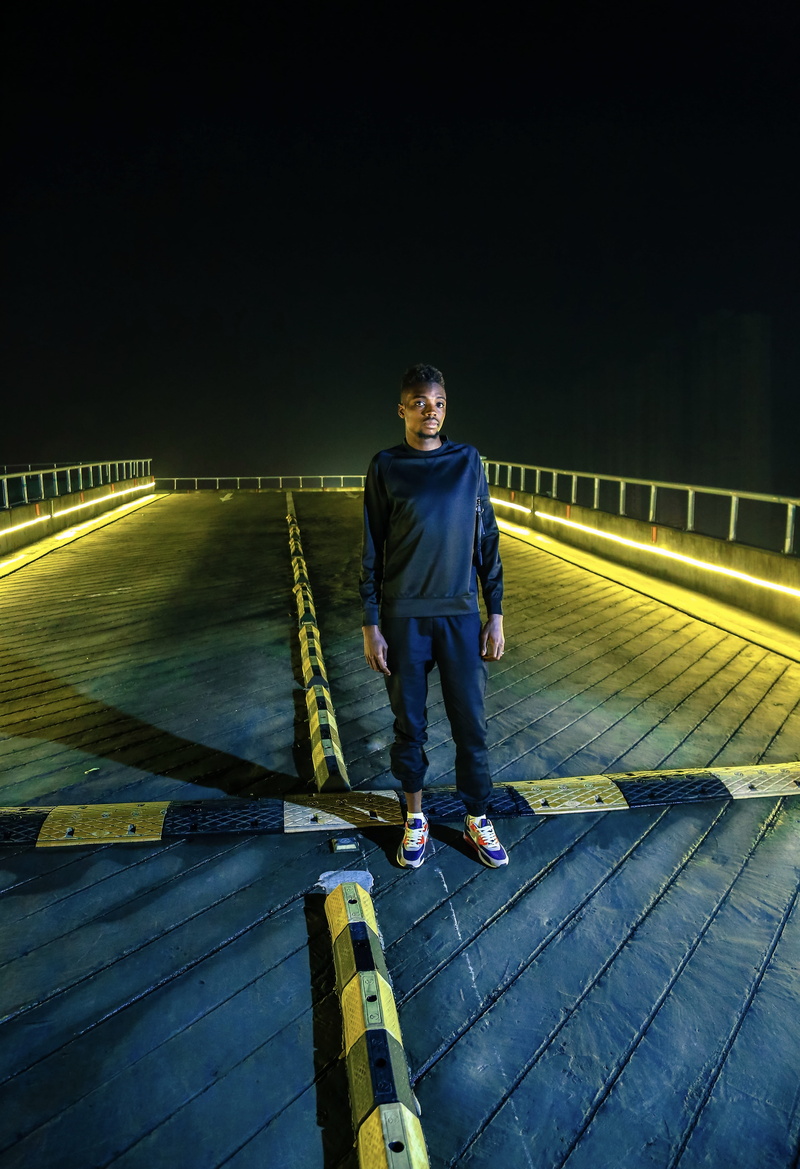 full length, apparel, lifestyles, banister, one person, road, 5K, casual clothing, men, boardwalk, the way forward, bridge, waterfront, building, handrail