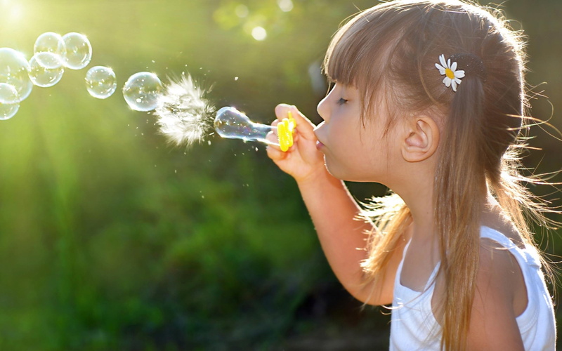 blowing, child, cute, sunlight, girls, holding, long hair, bubble, bubble wand, one person, Lips, fragility, women, offspring, vulnerability, hairstyle