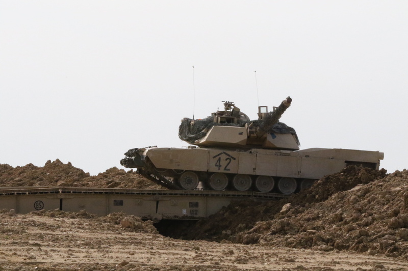 mode of transportation, land, laying, armored, clear sky, military, side view, protection, outdoor, no people, marines, single object, army, bridge, security
