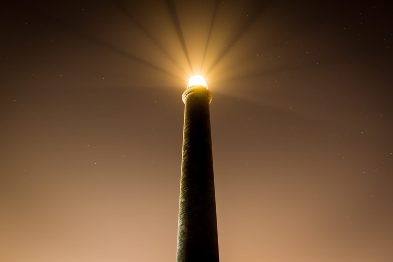 lighthouse, orange color, light beam, night, low angle view, yellow, burning, light - natural phenomenon, heat - temperature, illuminated, lighting equipment