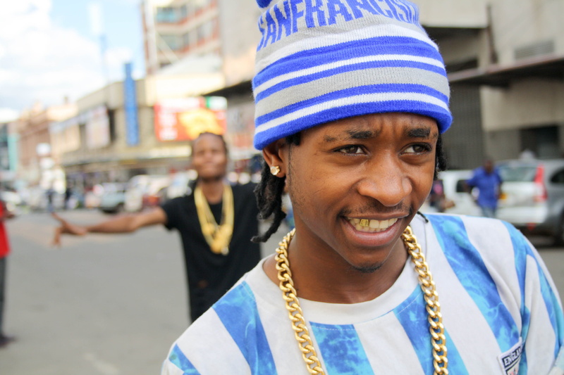 hustler, gold chains, looking at camera, adult, day, hustle, headshot, streets, one person, real people, focus on foreground, hip hop, versace, happiness