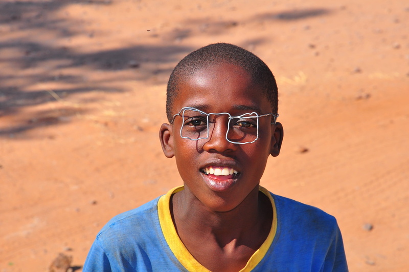 one person, front view, day, neck, real people, child, glasses, teenager, lifestyles, smiling, portrait, beach, happiness, travel, emotion, teenage boys