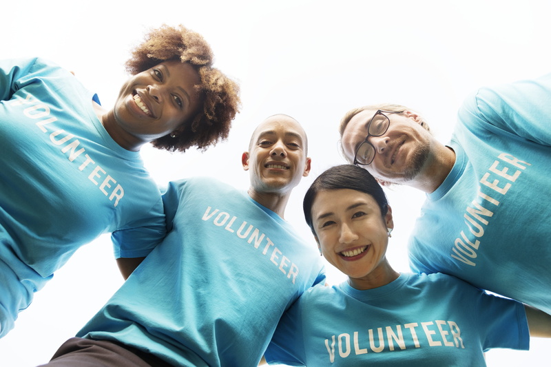 non profit, group of people, black, arms around, togetherness, emotion, charity, young adult, standing, community service, help, african descent, blue