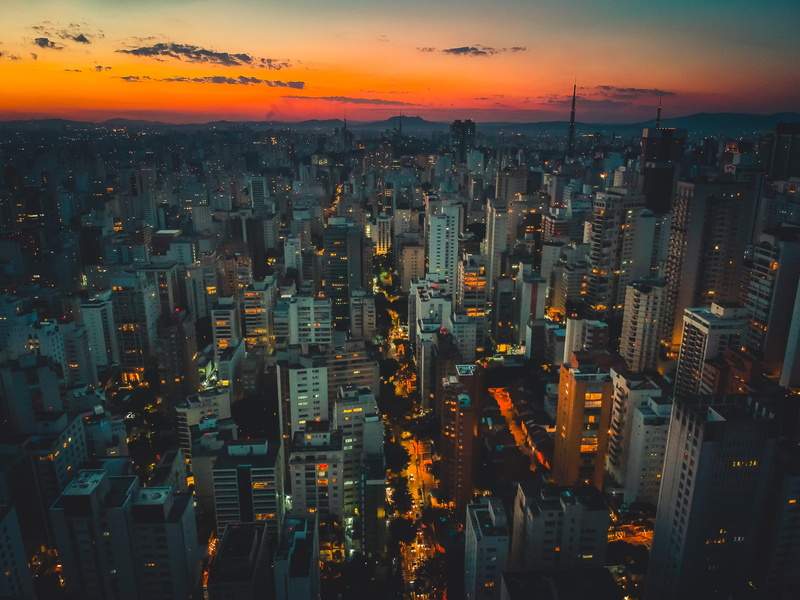 crowd, pordosol, skyscraper, tall - high, city, building, office building exterior, illuminated, financial district, drone, high angle view, cloud - sky